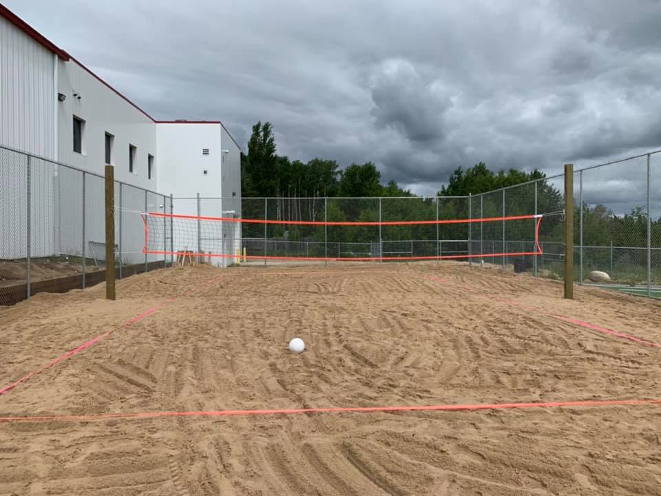 Outside beach volleyball court.